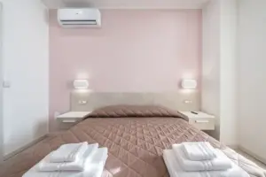 a bed with white towels on it
