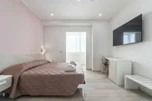 a room with a bed and a tv