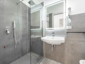 a bathroom with a shower and sink